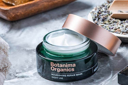 Botanima-Organics-Skincare-CBD-Nourishing-Repair-Mask-Open-Green-Jar-on-Marble-Surface