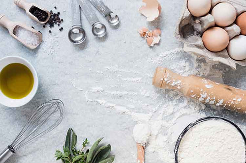 Baking Tools and Ingredients on Table