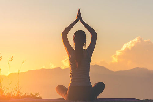 Woman Doing Yoga in the Sunset